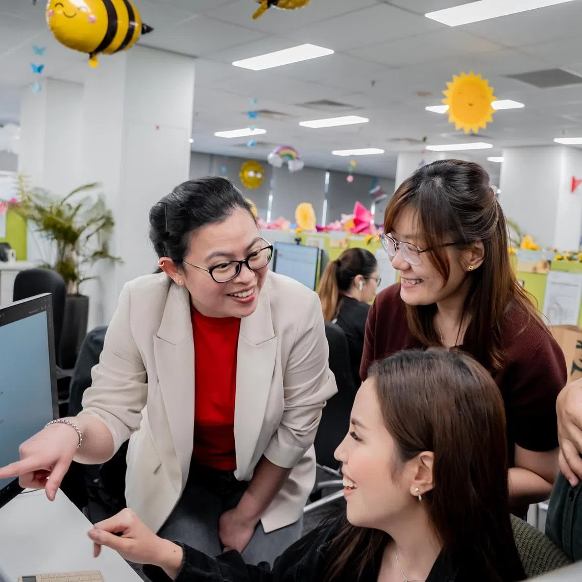 Nura Shereen Nordin (left) saves around 20 working hours each month through the use of AI tools.