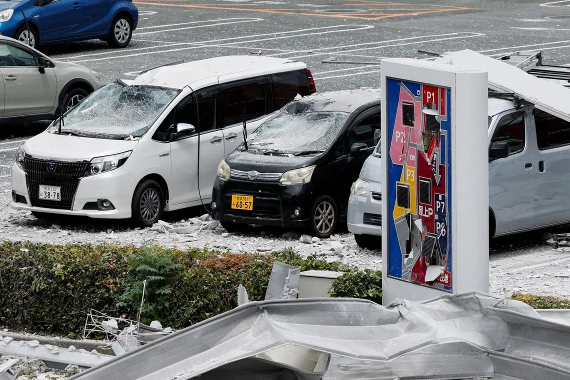 Damaged cars in a parking lot at the Aeon Mall shopping centre, where an explosion occurred after an earthquake with a magnitude of 7.1 struck Japan's southern Kumamoto prefecture, in Kashima Town, Kumamoto Prefecture, Japan, July 29, 2026. REUTERS/Kim Kyung-Hoon