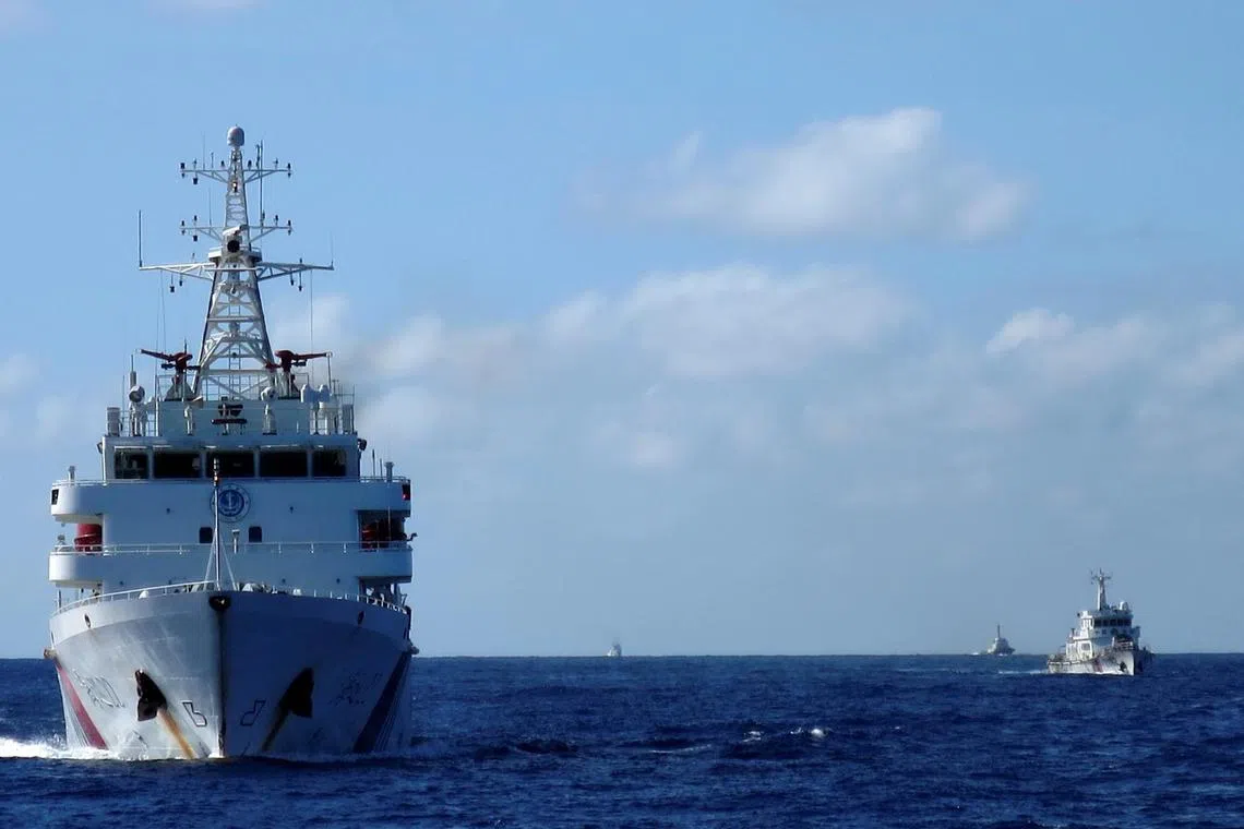 FILE PHOTO: Chinese coastguard ships in the South China Sea, July 15, 2014.  