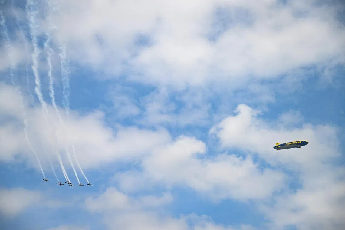 A general view of the Goodyear blimp as the Bandits Flight Team performs a flyover prior to the NASCAR Cup Series Goodyear 400 at Darlington Raceway  in Darlington, South Carolina, U.S., on May 14.