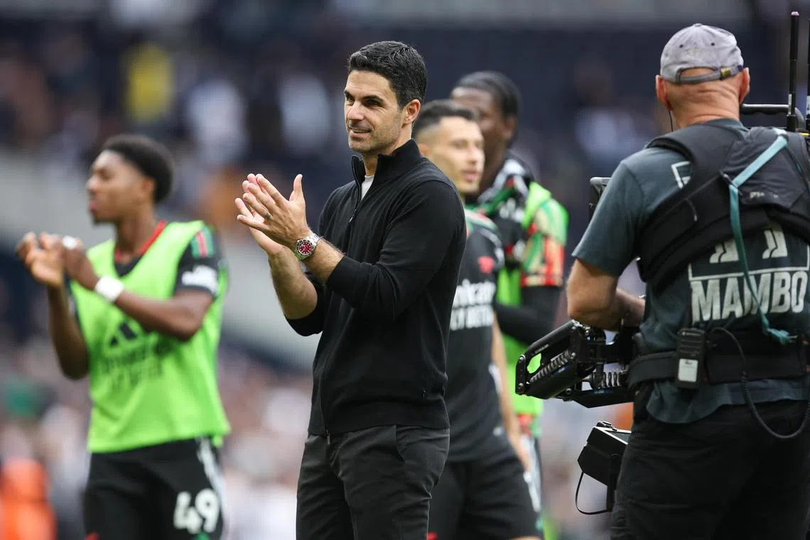 Arsenal manager Mikel Arteta applauds fans at the end of the English Premier League match against Tottenham.