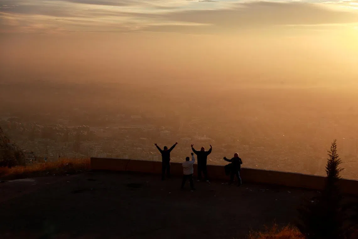 Men exercising as the sun rises over Damascus days after rebels seized the capital and ousted President Bashar al-Assad in Damascus, Syria, Dec 12, 2024. 