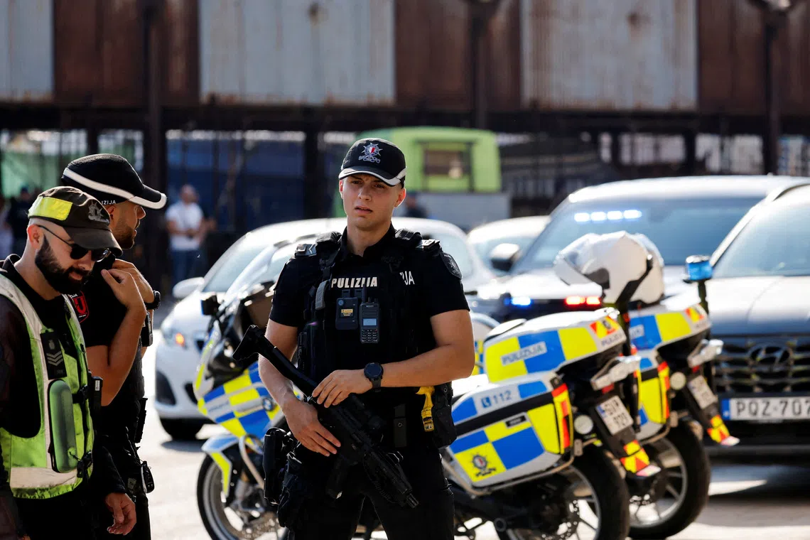 FILE PHOTO: Armed police officers provide security during a court on-site visit to the hitmen's hideout during the trial of alleged mastermind Yorgen Fenech, accused of conspiracy to murder journalist Daphne Caruana Galizia in 2017, in Marsa, Malta, August 14, 2026. REUTERS/Darrin Zammit Lupi/File Photo