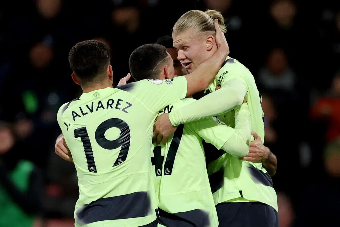 City's Erling Haaland celebrates scoring their second goal with Julian Alvarez and Phil Foden.