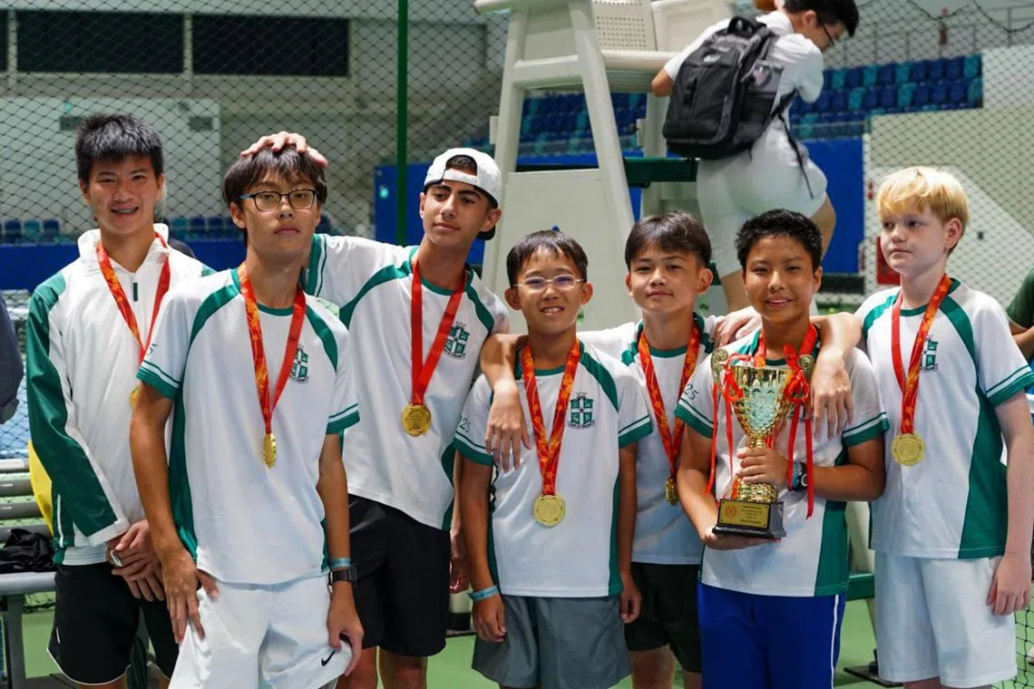 From left: St. Joseph's Institution's Raphael Goh, Gareth Kong, Asher Sandhu, Ng Shen Wei, Lim Yan Teng, Takuya Kaneko and Elias Siirtola posing with the C Division tennis trophy on Sept 1, 2025.