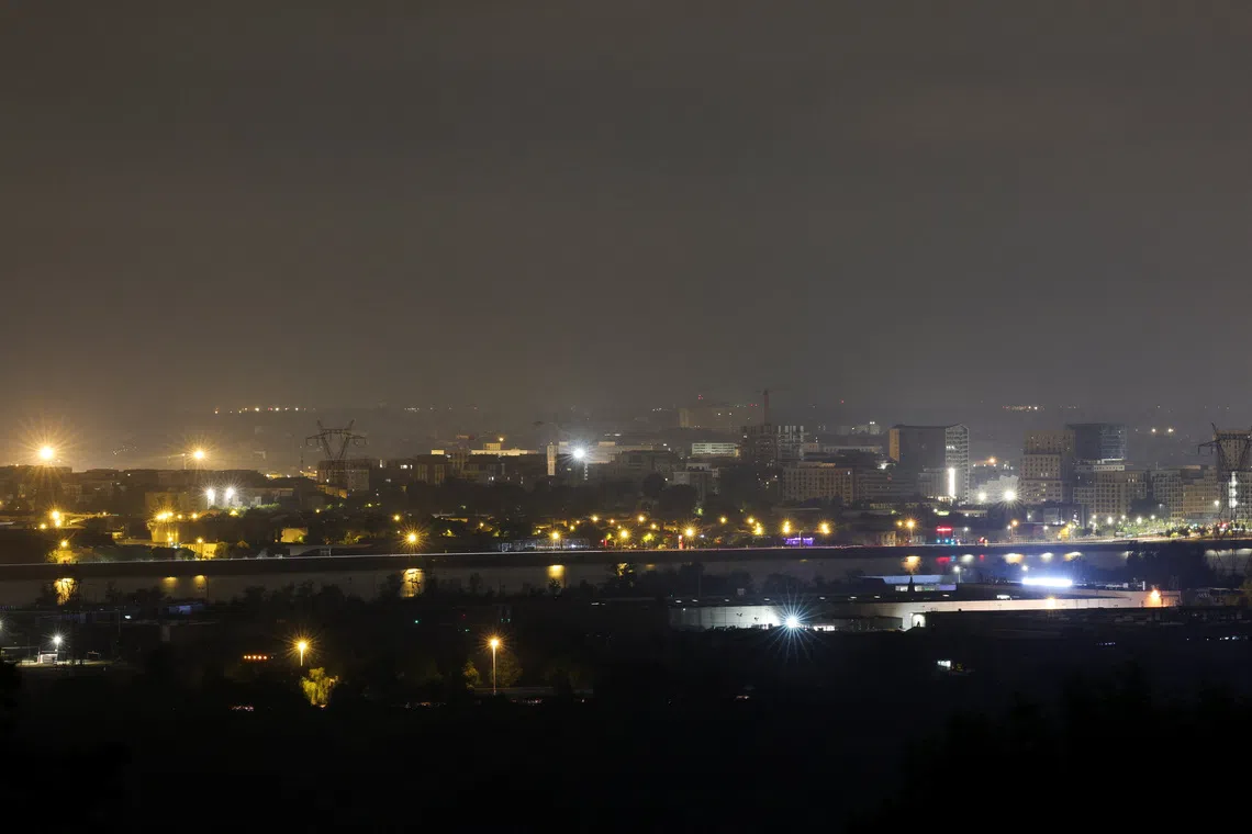 A view of the city of Bordeaux from Bouliac, as a wildfire burns nearby amid worsening drought conditions following a heatwave and water shortages across much of France, July 25, 2026. REUTERS/Stephane Mahe
