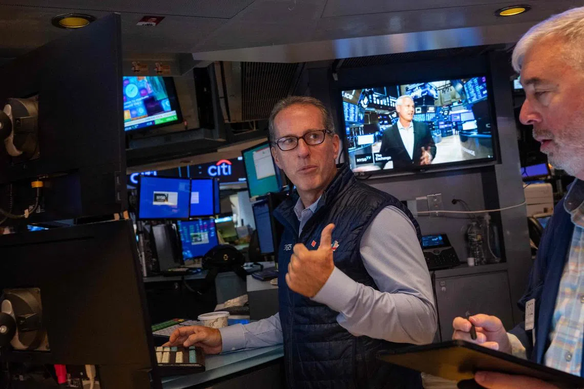 Traders working on the New York Stock Exchange floor on Sept 13, in New York City.