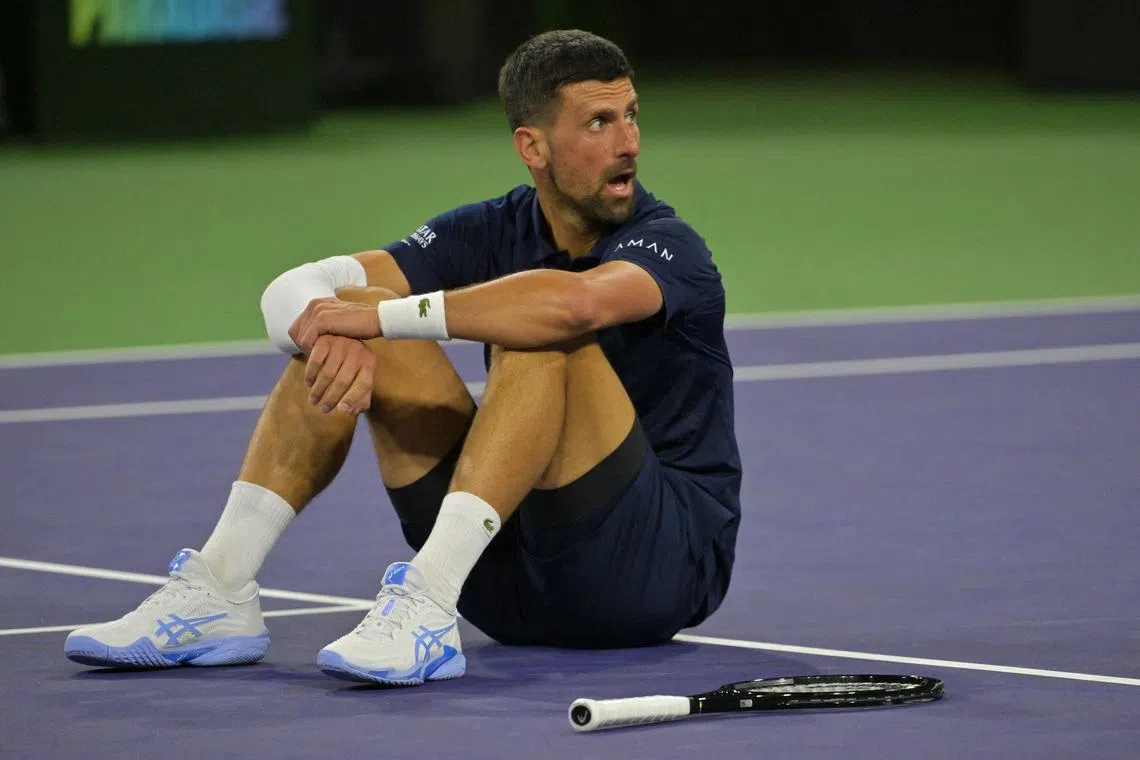 FILE PHOTO: Mar 11, 2026; Indian Wells, CA, USA;  Novak Djokovic (SRB) takes a moment on the court after a long rally during his fourth round match against Jack Draper (GBR) in the BNP Paribas Open at the Indian Wells Tennis Garden. Mandatory Credit: Jayne Kamin-Oncea-Imagn Images/File Photo