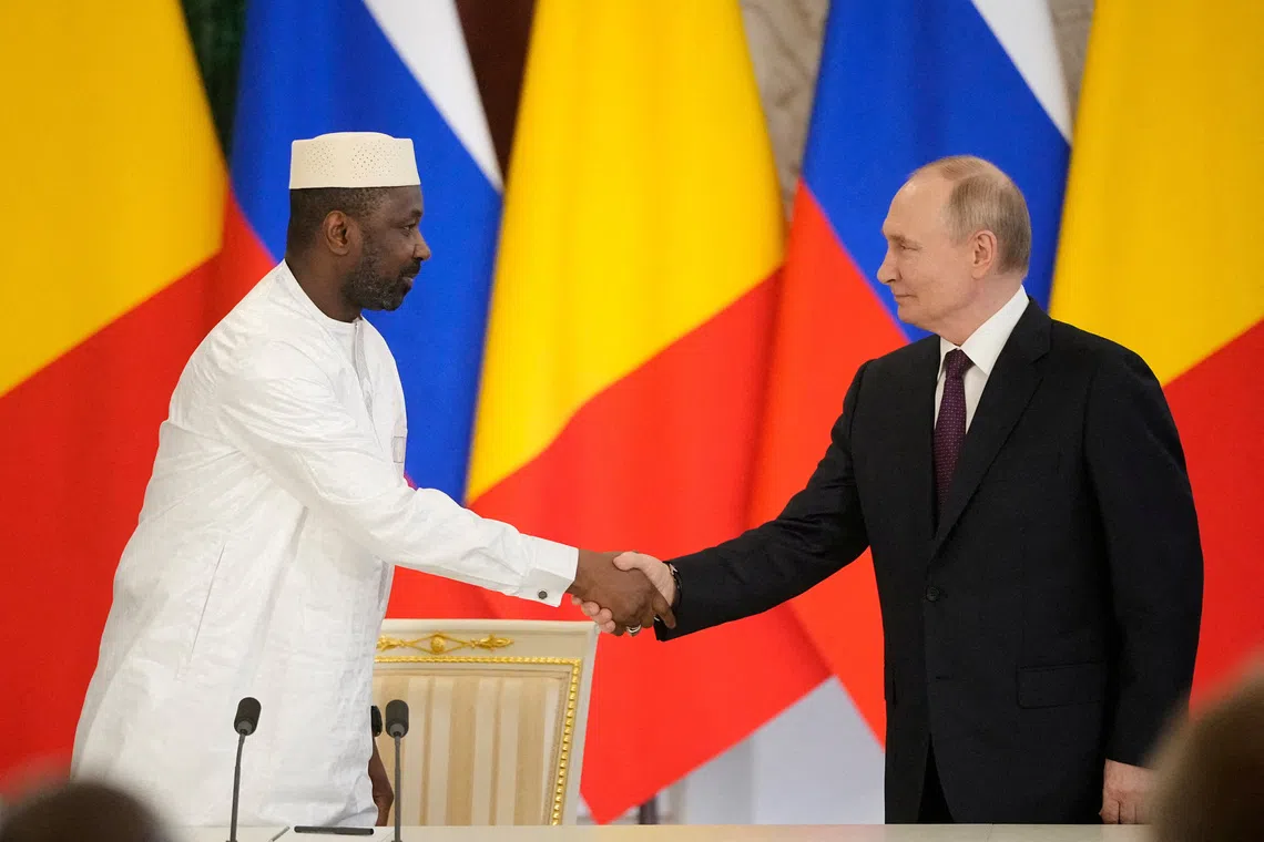 FILE PHOTO: Russian President Vladimir Putin shakes hands with Interim President of the Republic of Mali Assimi Goita during a signing ceremony following their talks at the Grand Kremlin Palace in Moscow, Russia June 23, 2025. Pavel Bednyakov/Pool via REUTERS/File Photo