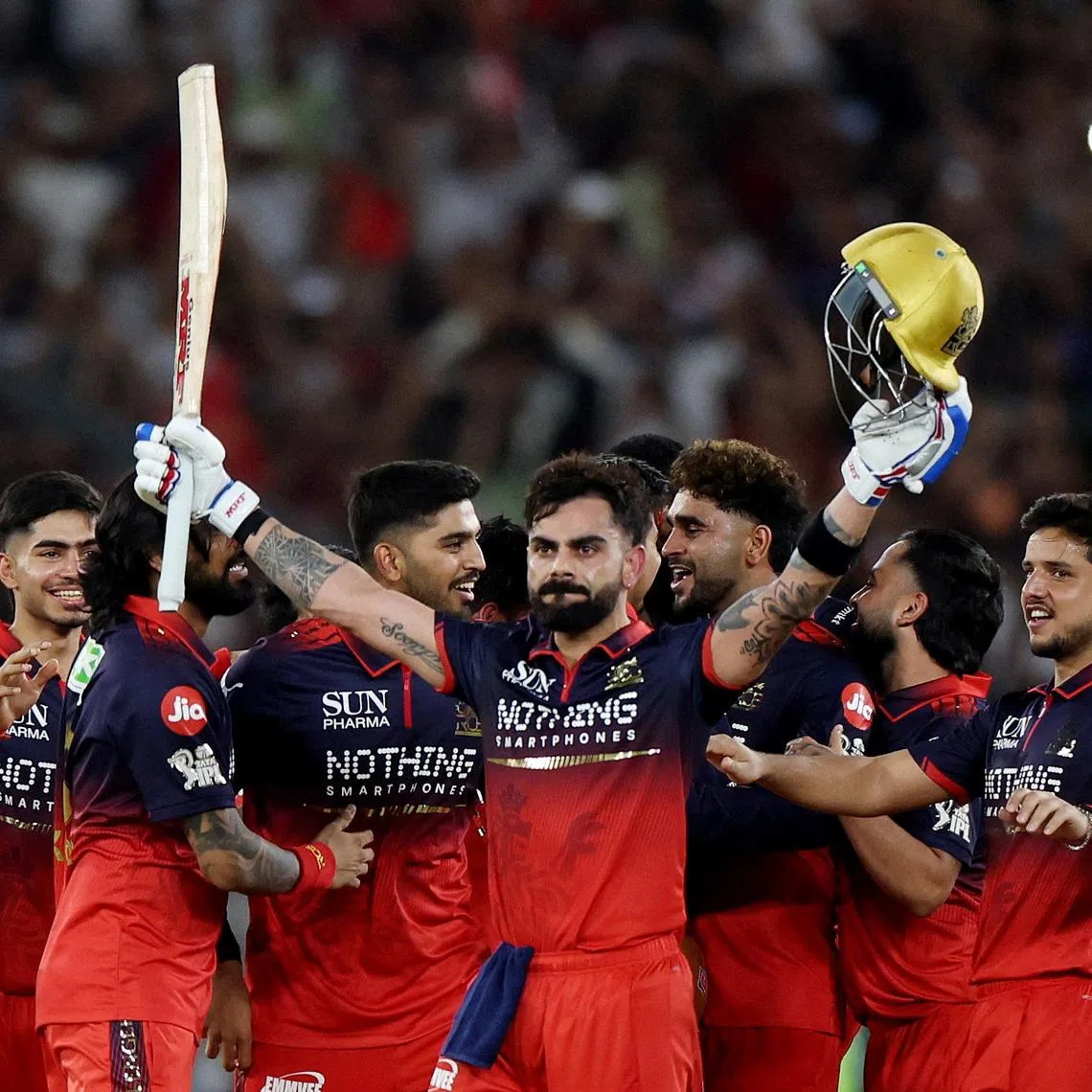 Cricket - Indian Premier League - IPL - Final - Royal Challengers Bengaluru v Gujarat Titans - Narendra Modi Stadium, Ahmedabad, India - May 31, 2026 Royal Challengers Bengaluru's Virat Kohli celebrates with teammates after winning the Indian Premier League REUTERS/Amit Dave
