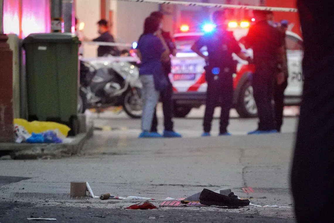 Investigators near the scene of the Beach Road slashing on Apr 14, 2022. 