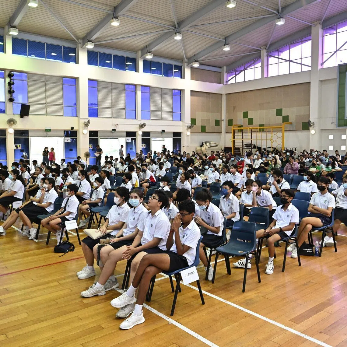 Students waiting to collect their PSLE results at Opera Estate Primary School on Nov 23, 2022.