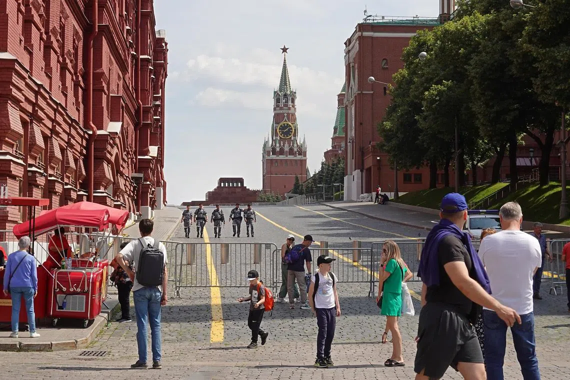 epa10710718 People walk near barriers blocking the way to the Red Square in Moscow, Russia, 25 June 2023. On 24 June, counter-terrorism measures were enforced in Moscow and other Russian regions after private military company (PMC) Wagner Group's chief claimed that his troops had occupied the building of the headquarters of the Southern Military District in Rostov-on-Don, demanding a meeting with Russia's defense chiefs. Belarusian President Lukashenko, a close ally of Putin, negotiated a deal with Wagner chief Prigozhin to stop the movement of the group's fighters across Russia, the press service of the President of Belarus reported. The negotiations were said to have lasted for the entire day. Prigozhin announced that Wagner fighters were turning their columns around and going back in the other direction, returning to their field camps.  EPA-EFE/MAXIM SHIPENKOV