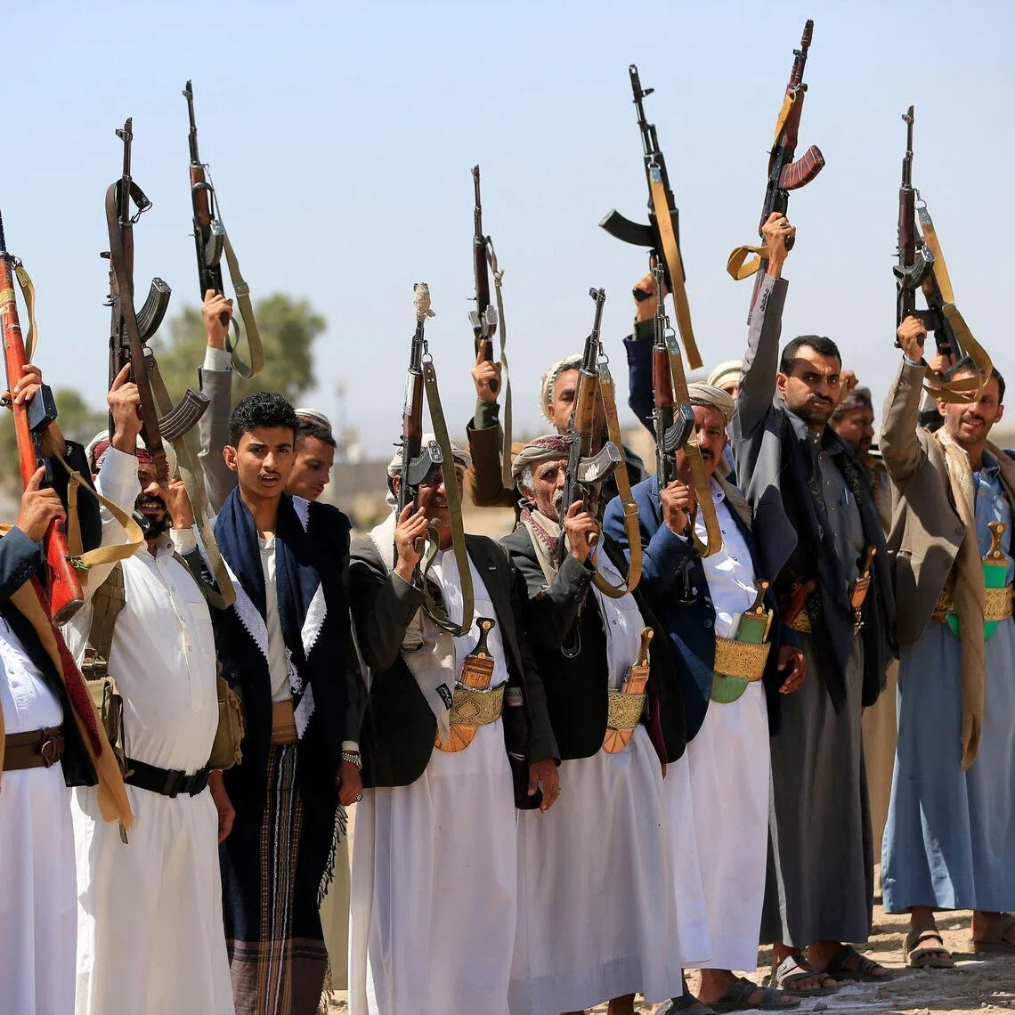 Armed Yemenis brandish their weapons as they rally in solidarity with Lebanon and Iran on the outskirts of the Houthi-controlled capital Sanaa on July 2. The rebels control Sanaa and much of the north, while the internationally recognised government holds much of the south.