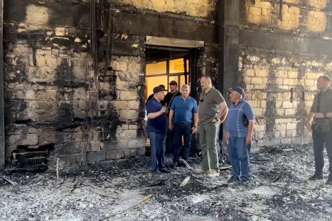 FILE PHOTO: Sergei Melikov, the head of the Dagestan region, visits Derbent synagogue following an attack by gunmen and a fire, in Derbent in the region of Dagestan, Russia June 24, 2024, in this still image taken from video. Head of the Dagestan region Sergei Melikov via Telegram/Handout via REUTERS/File Photo