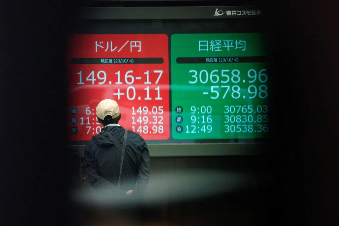 Asian shares slid after US consumer prices increased more than expected, bolstering the case for the Federal Reserve to keep rates higher for longer.