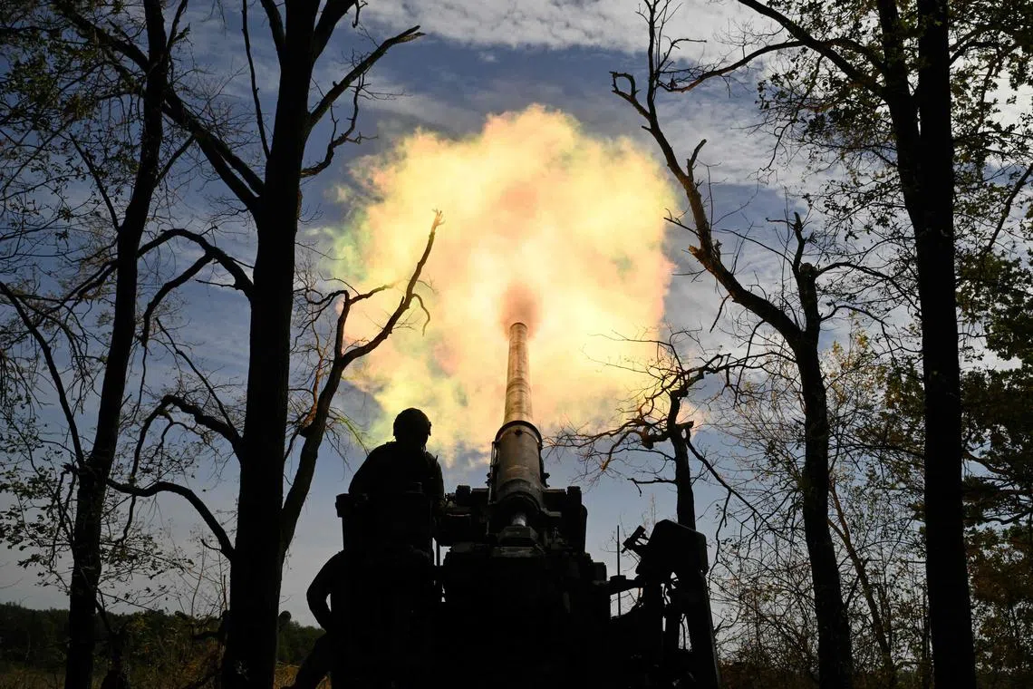 Ukrainian servicemen firing a self-propelled cannon towards Russian positions in Ukraine's Donetsk region, in September 2024.
