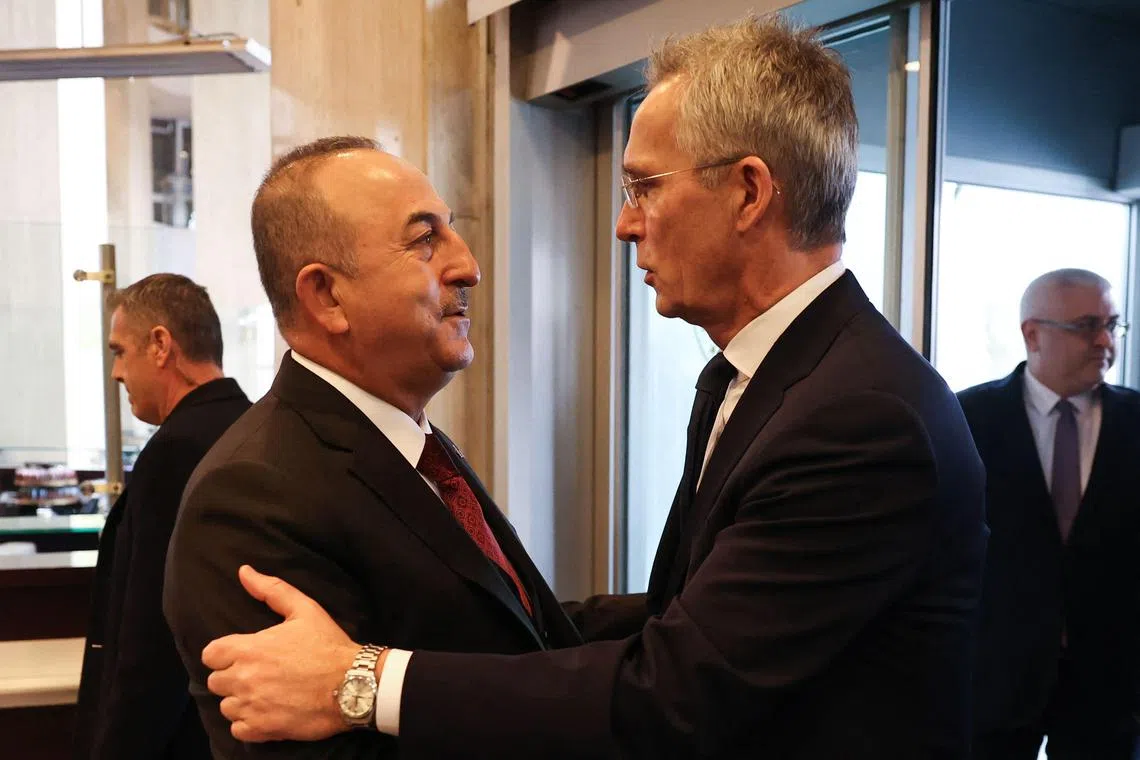 Turkish Foreign Minister Mevlut Cavusoglu (L) meeting with NATO Secretary General Jens Stoltenberg (R) in Ankara on Thursday who called for Turkey to join Hungary in ratifying Sweden and Finland into the 30-nation alliance