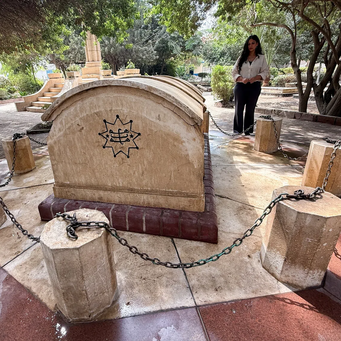 Egyptian Baha'i architect Joumana Labib stands in a cemetery dedicated to members of the Baha'i community in the Al-Basateen district of Cairo, Egypt, October 2, 2026. Picture taken with a mobile phone. REUTERS/Stringer