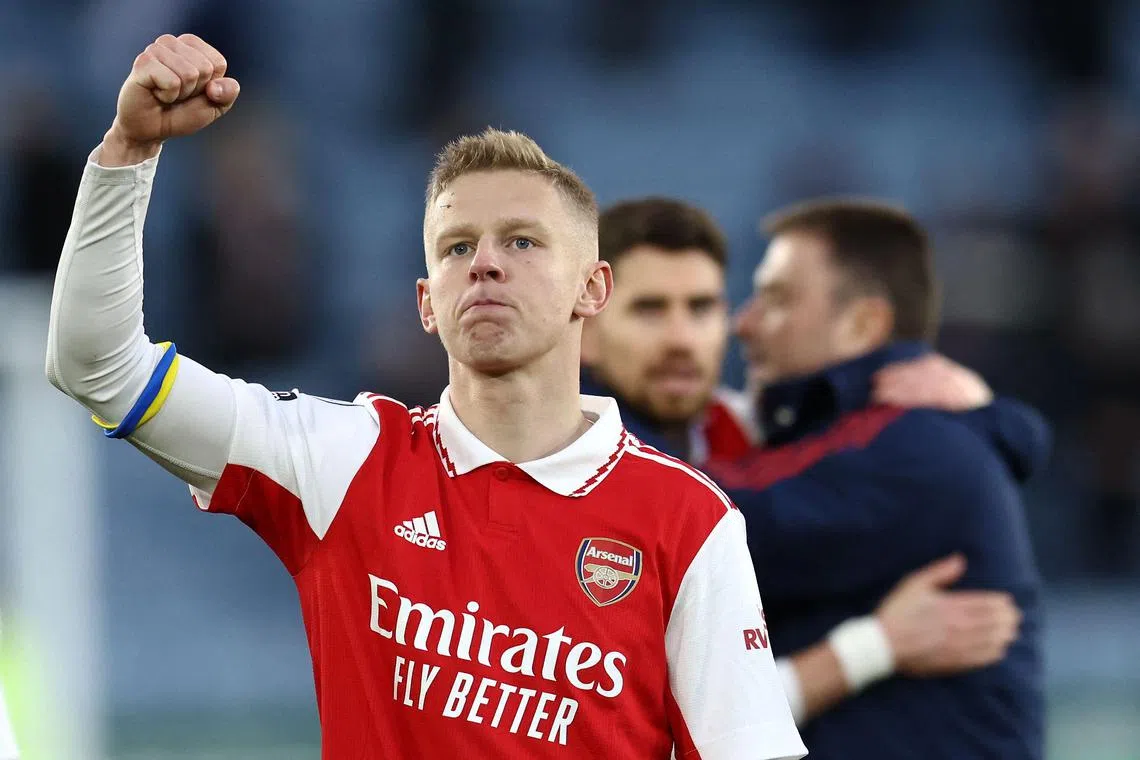 Arsenal's Ukrainian defender Oleksandr Zinchenko shows respect to the fans after the final whistle against Leicester City.
