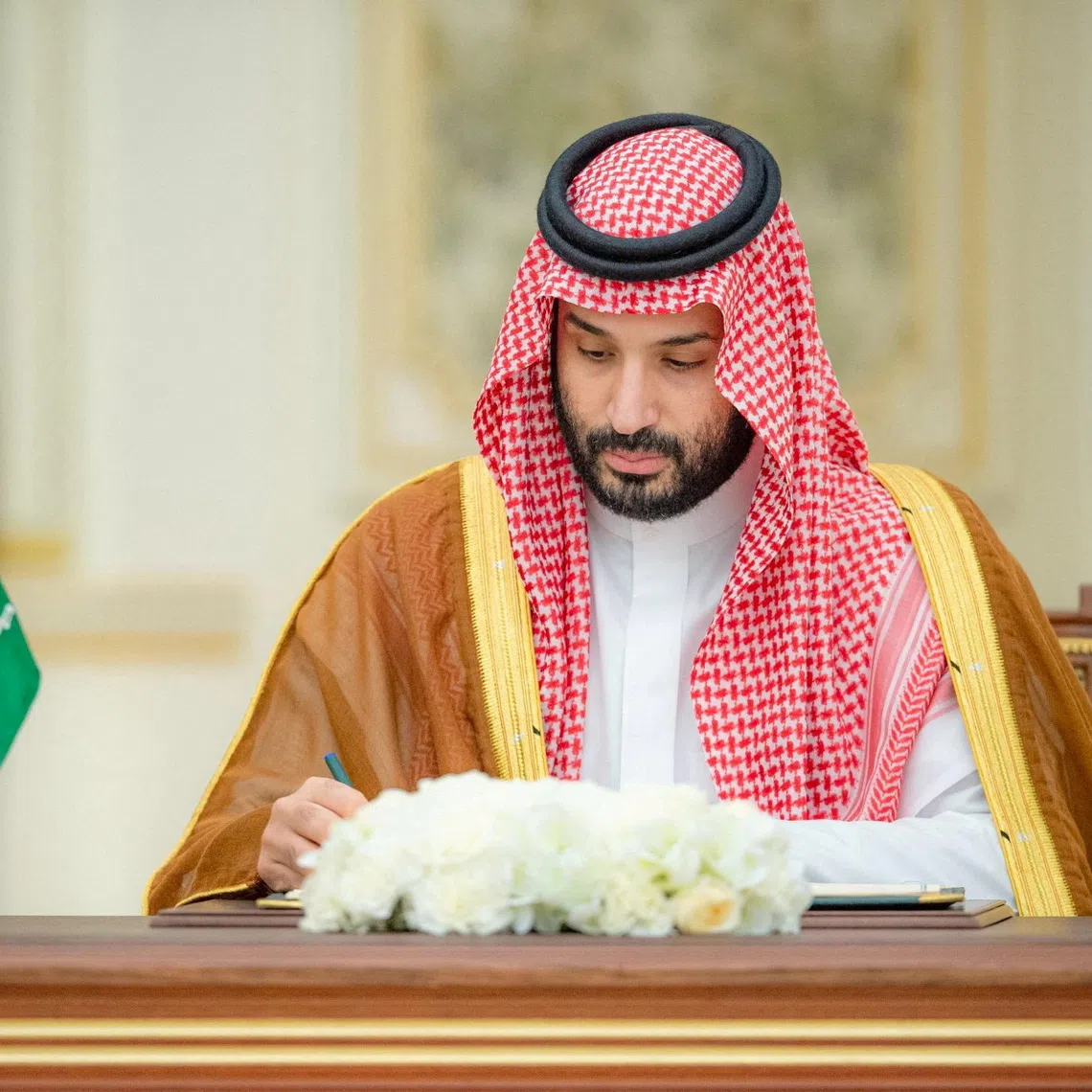 FILE PHOTO: Saudi Crown Prince Mohammed bin Salman signs a defence agreement next to Pakistan Prime Minister Shehbaz Sharif (not pictured) in Riyadh, Saudi Arabia, September 17, 2025. Saudi Press Agency/Handout via REUTERS