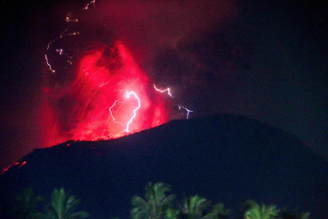 Lightning struck as lava erupts from the crater of Mount Ibu.