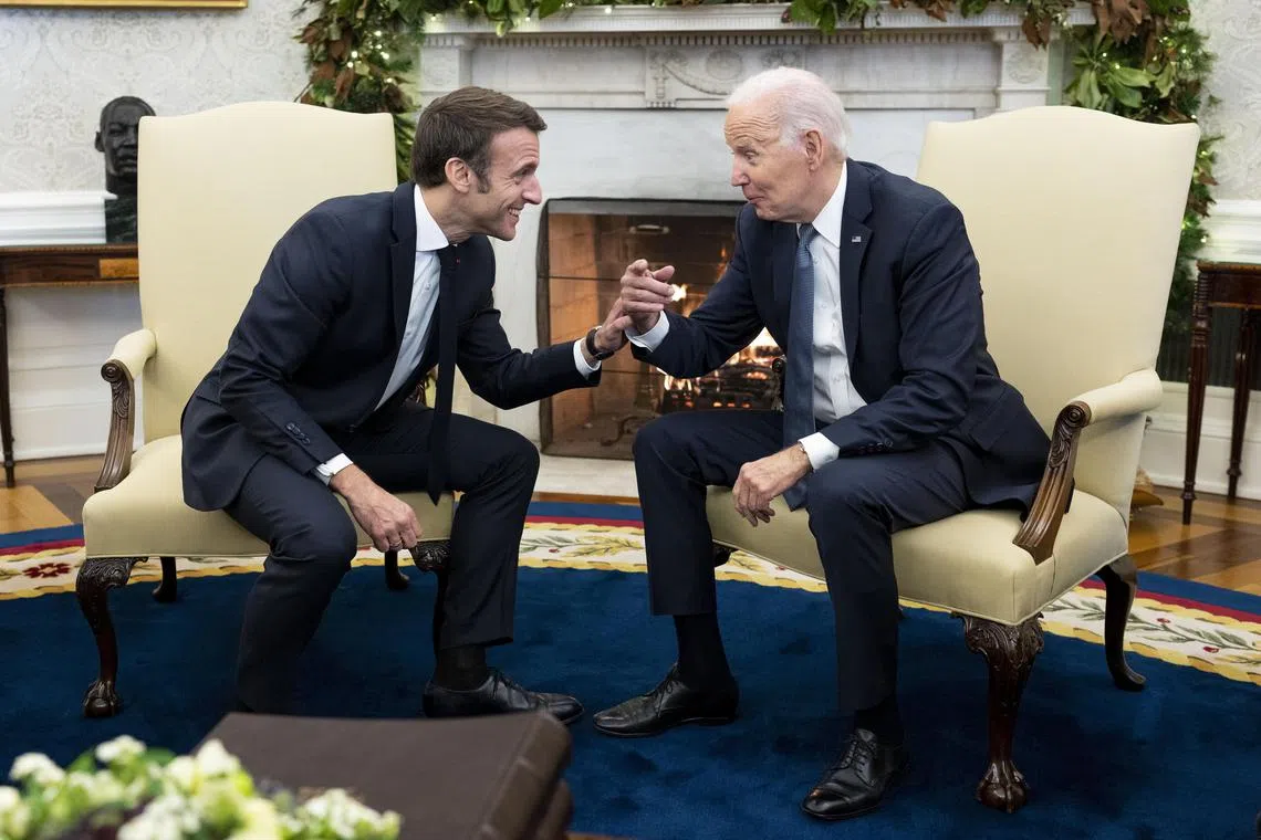 US President Joe Biden and French President Emmanuel Macron meeting in the Oval Office, at the White House in Washington on Dec 1. 