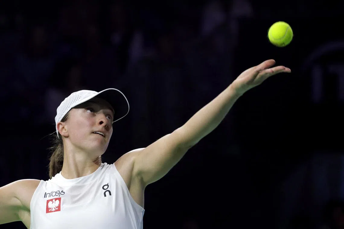 FILE PHOTO: Poland's Iga Swiatek in action during her match against Italy's Jasmine Paolini in this file photo, Malaga, Spain - November 18, 2024. REUTERS/Jon Nazca/File Photo