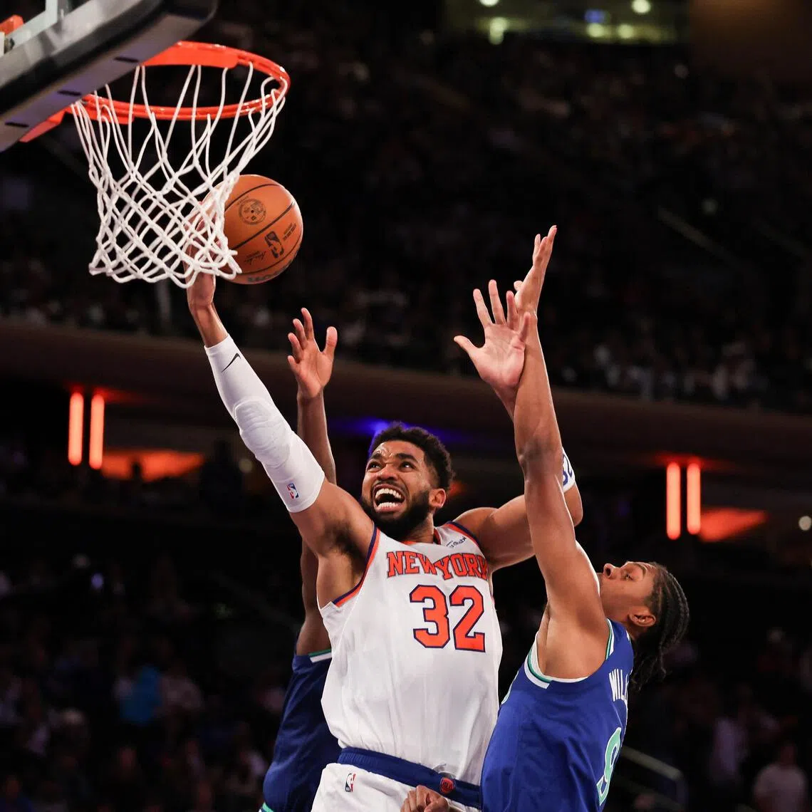 Karl-Anthony Towns going for the basket against Cody Williams of the Minnesota Timberwolves during their pre-season game at Madison Square Garden on Oct 12.