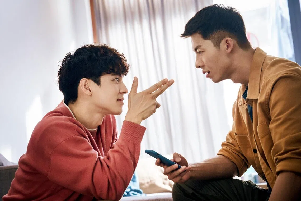 Austin Lin (left) played a gay ghost in the comedy film Marry My Dead Body (2022), opposite Taiwanese actor Greg Hsu (right).