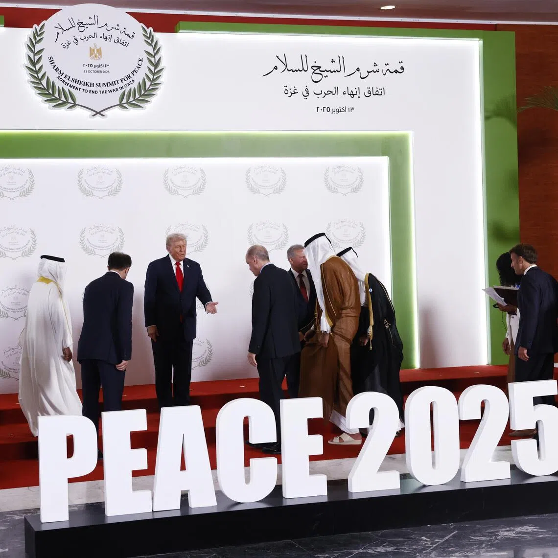 US President Donald Trump taking centre stage at the summit on Gaza in Sharm el-Sheikh, Egypt, on Oct 13.