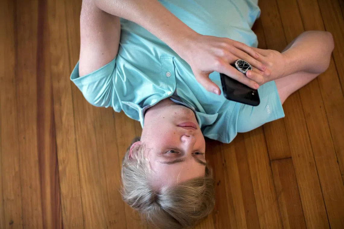 A fifteen-year-old using his smartphone in Metter, Ga. on April 26, 2021. While many scientists share the concern, there is little research to prove that social media is harmful — or to indicate which sites, apps or features are problematic. 