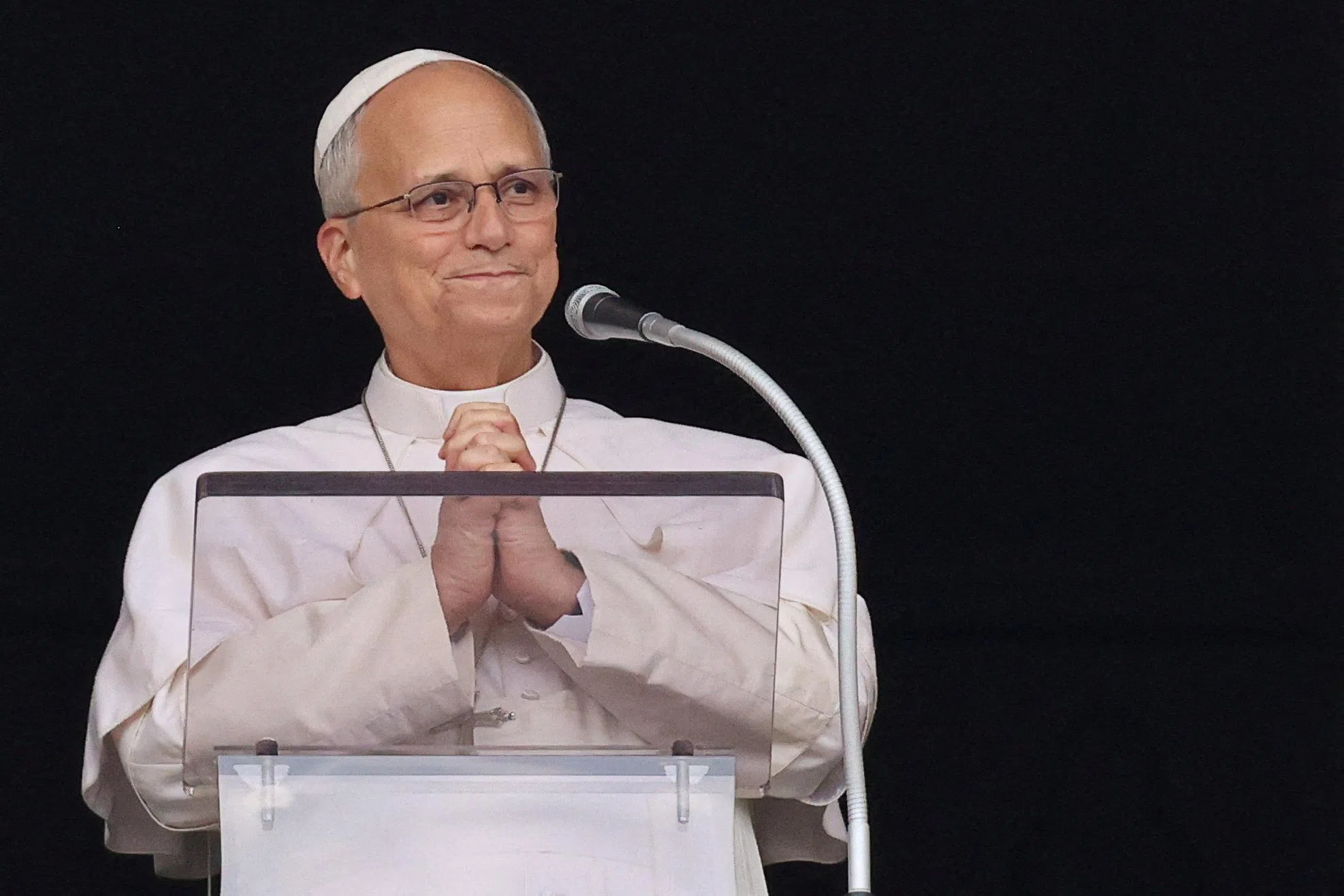 FILE PHOTO: Pope Leo gestures as he leads the Angelus prayer from a window of the Apostolic Palace following his discharge from hospital after surgery for lung cancer, at the Vatican, October 18, 2026. REUTERS/Yara Nardi/File Photo