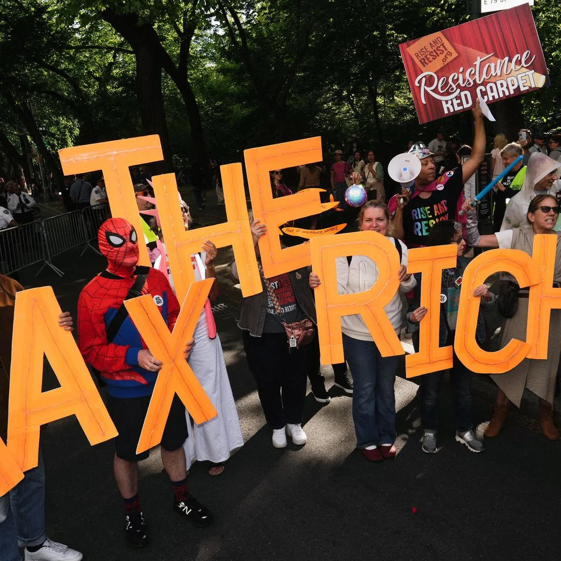 Demonstrators participate in a “Resistance Red Carpet” protest against the Met Gala, the star-studded fundraiser known for its extravagant fashion and high-profile guests, in New York City, U.S., May 4, 2026. REUTERS/Bing Guan
