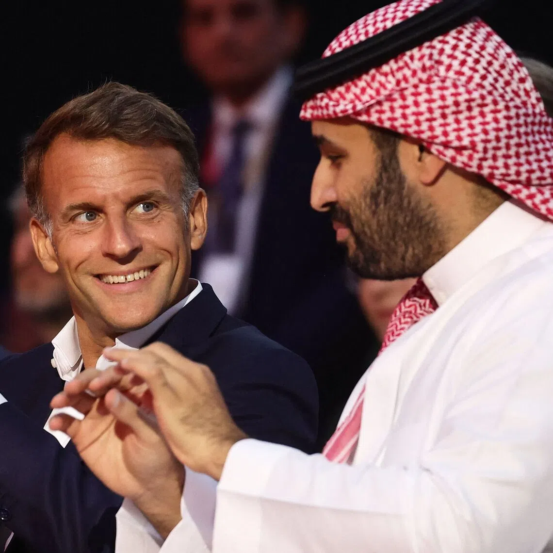 Saudi Crown Prince Mohammed bin Salman (right) and French President Emmanuel Macron at the Grand Palais in Paris, on Aug 23.