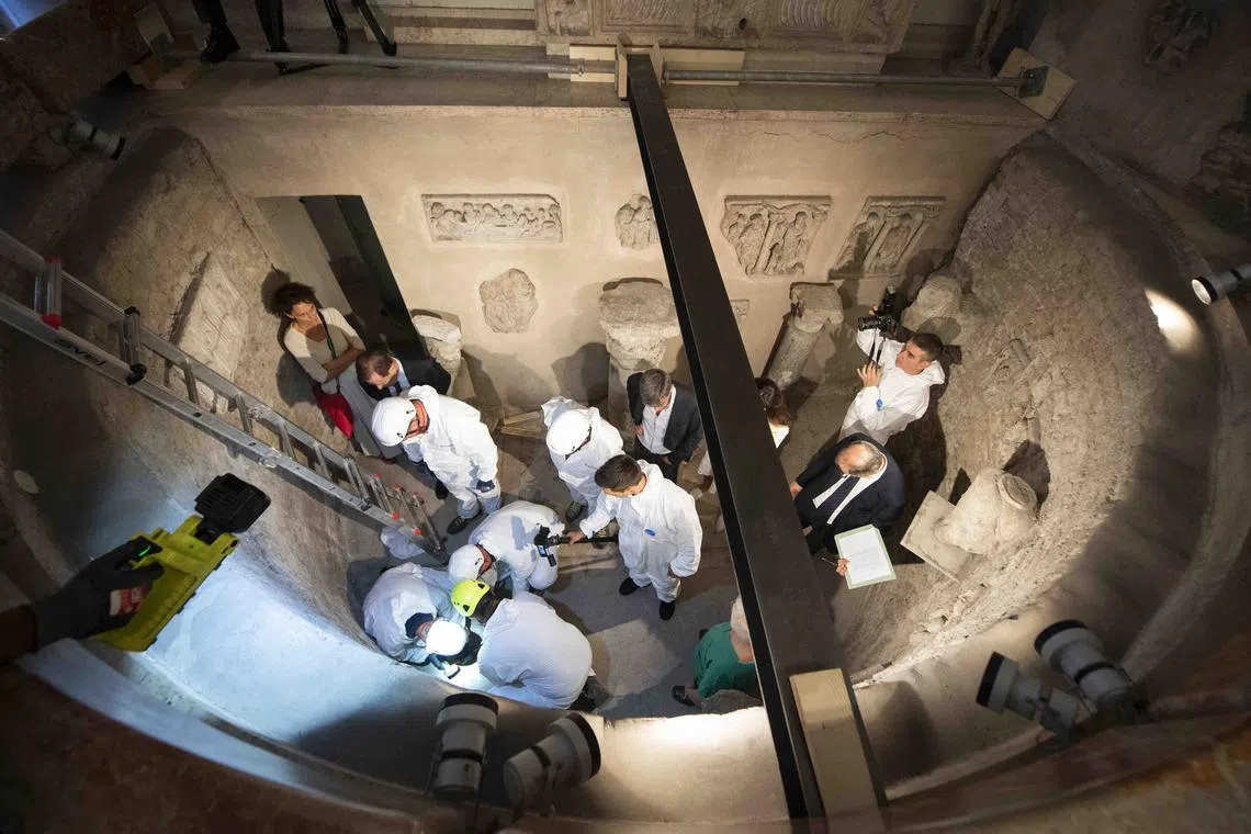 Workers inspecting an ossuary in the Vatican in 2019, as part of a probe into the disappearance of teenager Emanuela Orlandi.