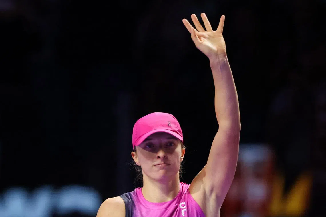 Defending WTA champion Iga Swiatek bids the crowd farewell, after winning against Russia's Daria Kasatkina on Nov 7 but failing to make the the last four of the WTA Finals.
