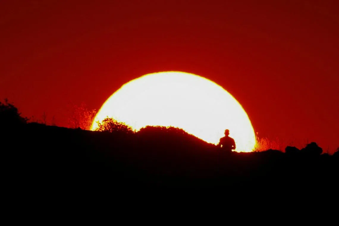 A man jogging at sunset in Pembroke, Malta, on July 30, 2024. 