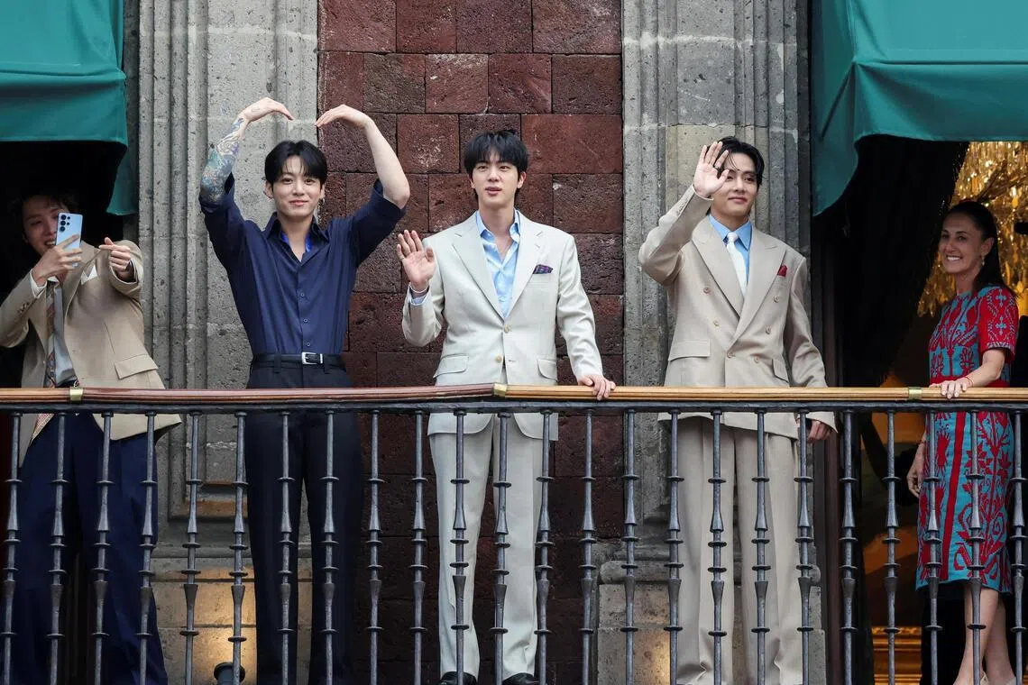 Members of BTS on a balcony at Mexico’s National Palace. The South Korean Kpop boy band will be taking the stage at the World Cup final’s halftime show.