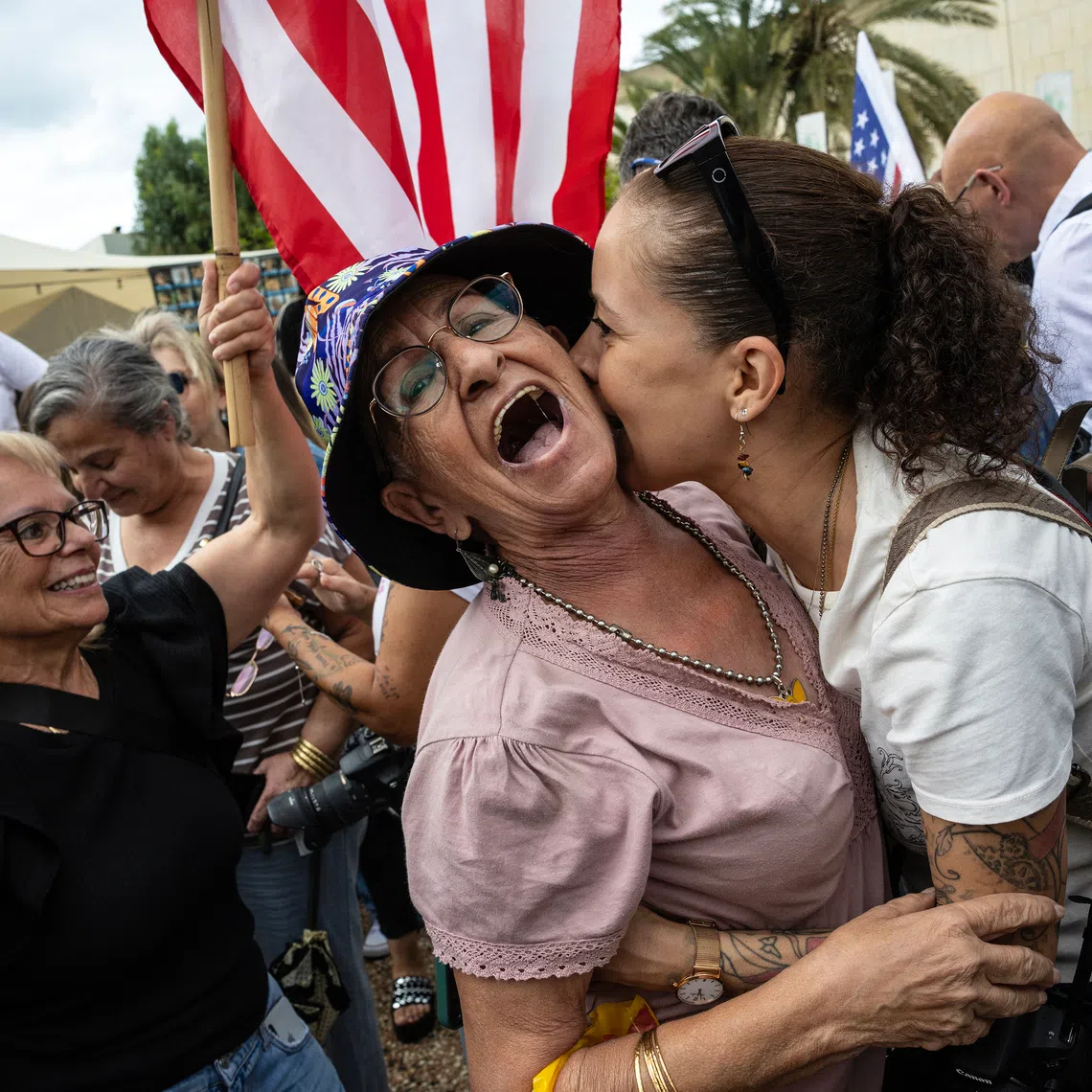 Israelis embrace and celebrate at Hostages Square in Tel Aviv, Israel, on Oct 9.