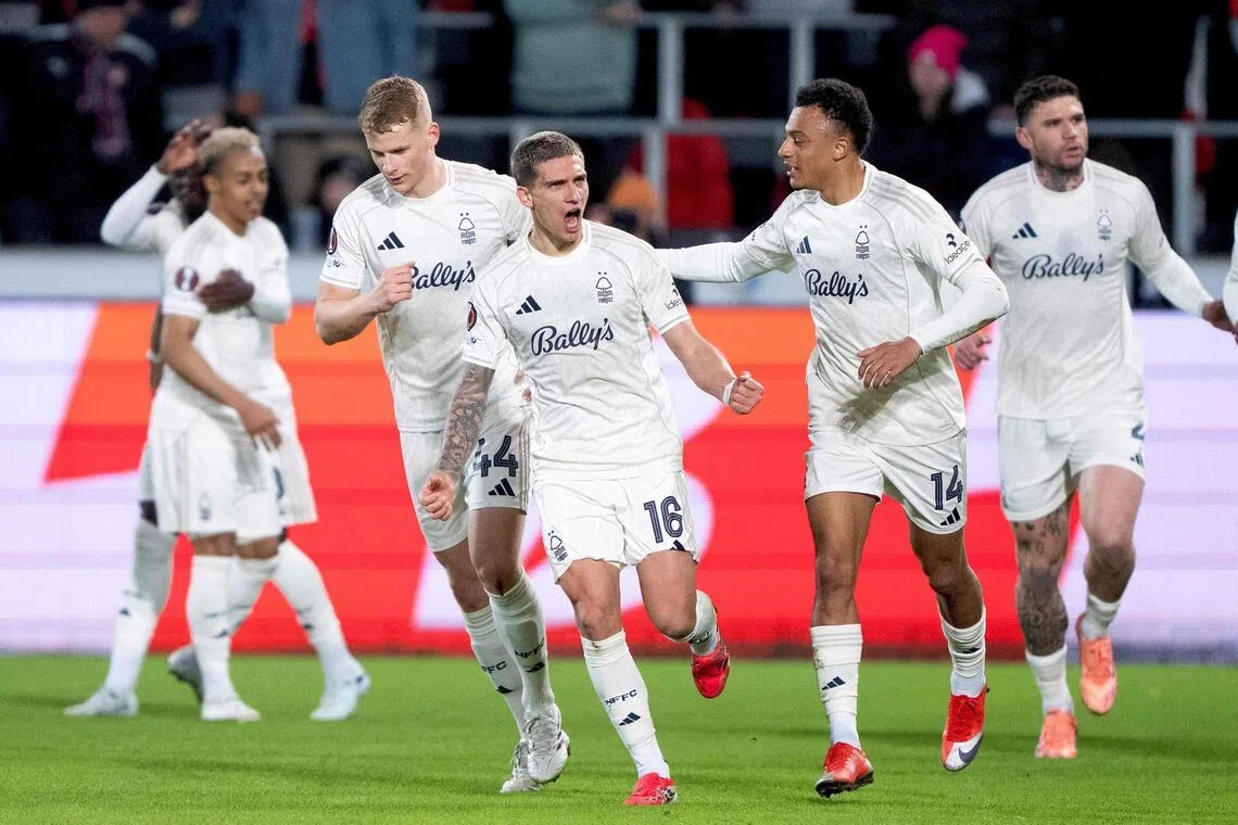 Nottingham Forest's Nicolas Dominguez celebrates scoring their first goal with teammates.