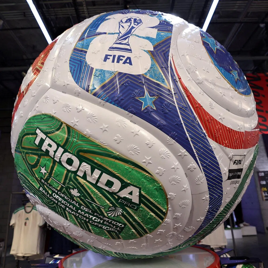 FILE PHOTO: A giant model of the official Trionda pro match ball for the FIFA 2026 World Cup is displayed inside the Adidas store in Manhattan in New York City, U.S., January 7, 2026. REUTERS/Mike Segar/File Photo
