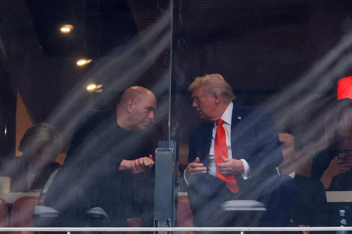 Ultimate Fighting Championship CEO Dana White (left) speaking with US President Donald Trump at the memorial service for political activist Charlie Kirk at State Farm Stadium on Sept 21, 2025 in Glendale, Arizona.