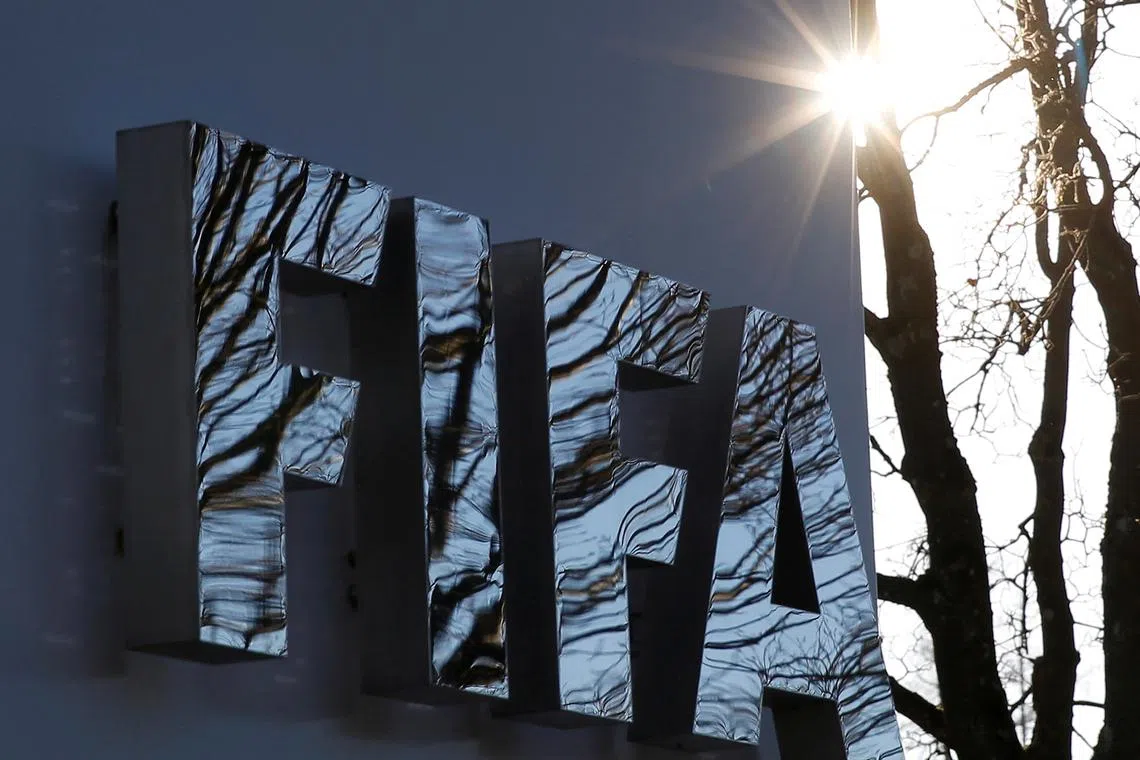 FILE PHOTO: The FIFA logo is seen outside the FIFA headquarters in Zurich, Switzerland December 17, 2015. REUTERS/Ruben Sprich/File Photo