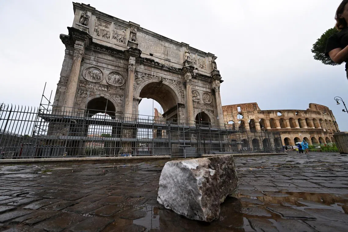 Fragments of Constantine's Arch lie on the ground after lightning struck it during a storm in Rome, Italy September 3, 2024. REUTERS/Alberto Lingria