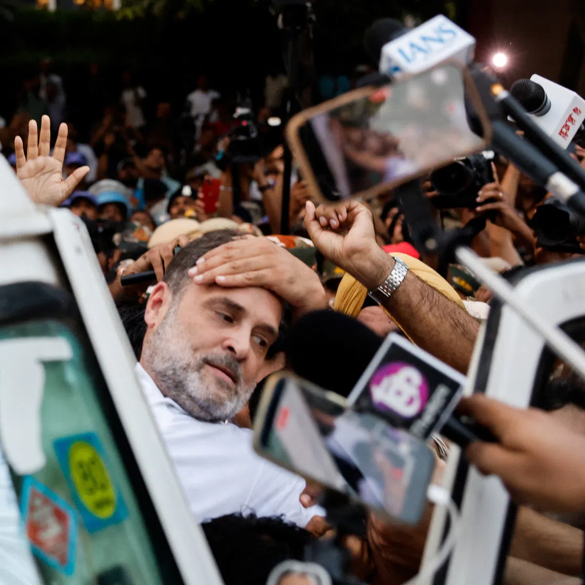 Indian opposition leader Rahul Gandhi is detained by police in New Delhi on Oct 7.