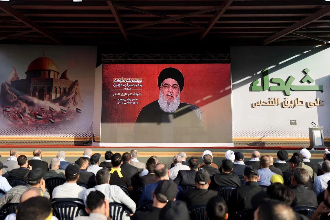 Supporters of the Hezbollah watch a televised speech by its leader Hassan Nasrallah in the Lebanese capital Beirut on Nov 3.