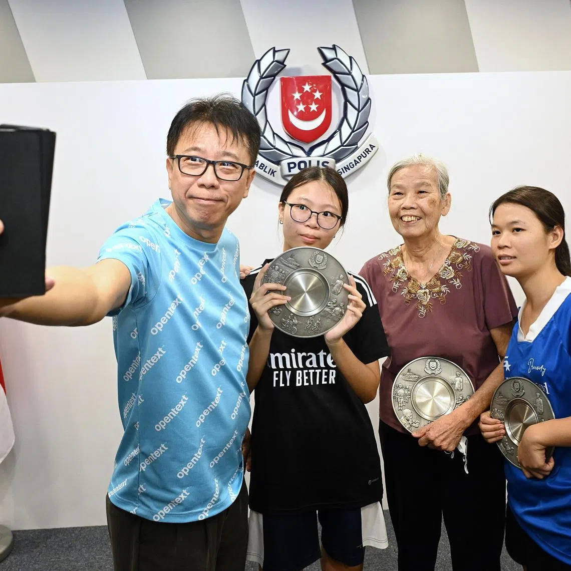 From left: Mr Siah Ee Fong (light blue shirt), Ms Siah Jia Lin, Ms Ho Soo Pong and Ms Aye Nandar Aung at the Bedok Police Division HQ on May 23, 2024. 