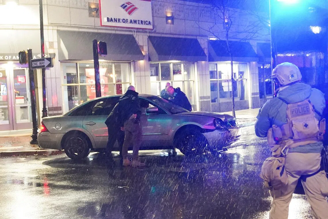 Members of the United States Secret Service react to a vehicle crashing into a Secret Service SUV that was blocking the street.