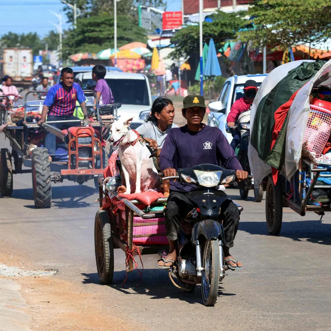 Residents evacuating following air strikes in Cambodia's Siem Reap province on Dec 15, 2025.